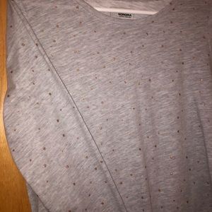 Gray long sleeve shirt with gold polka dots.